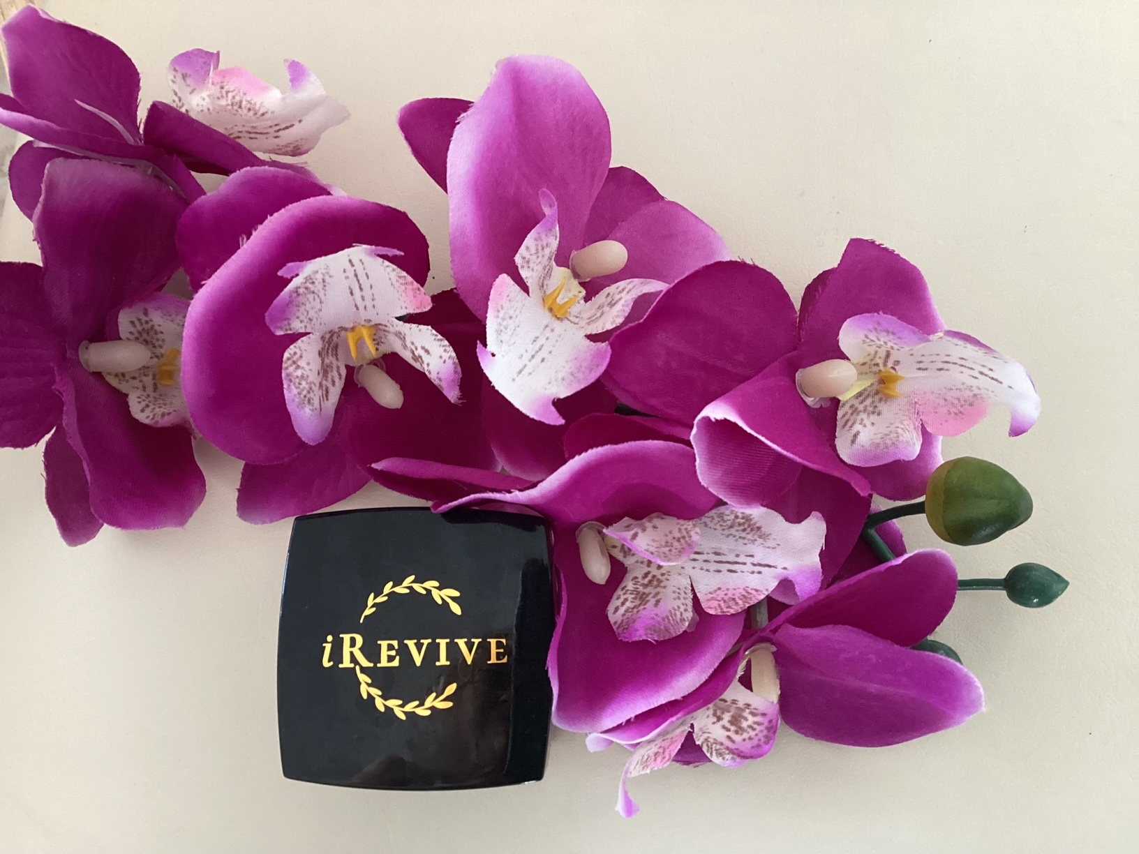 iRevive Quantum Skin Cream jar with purple orchids